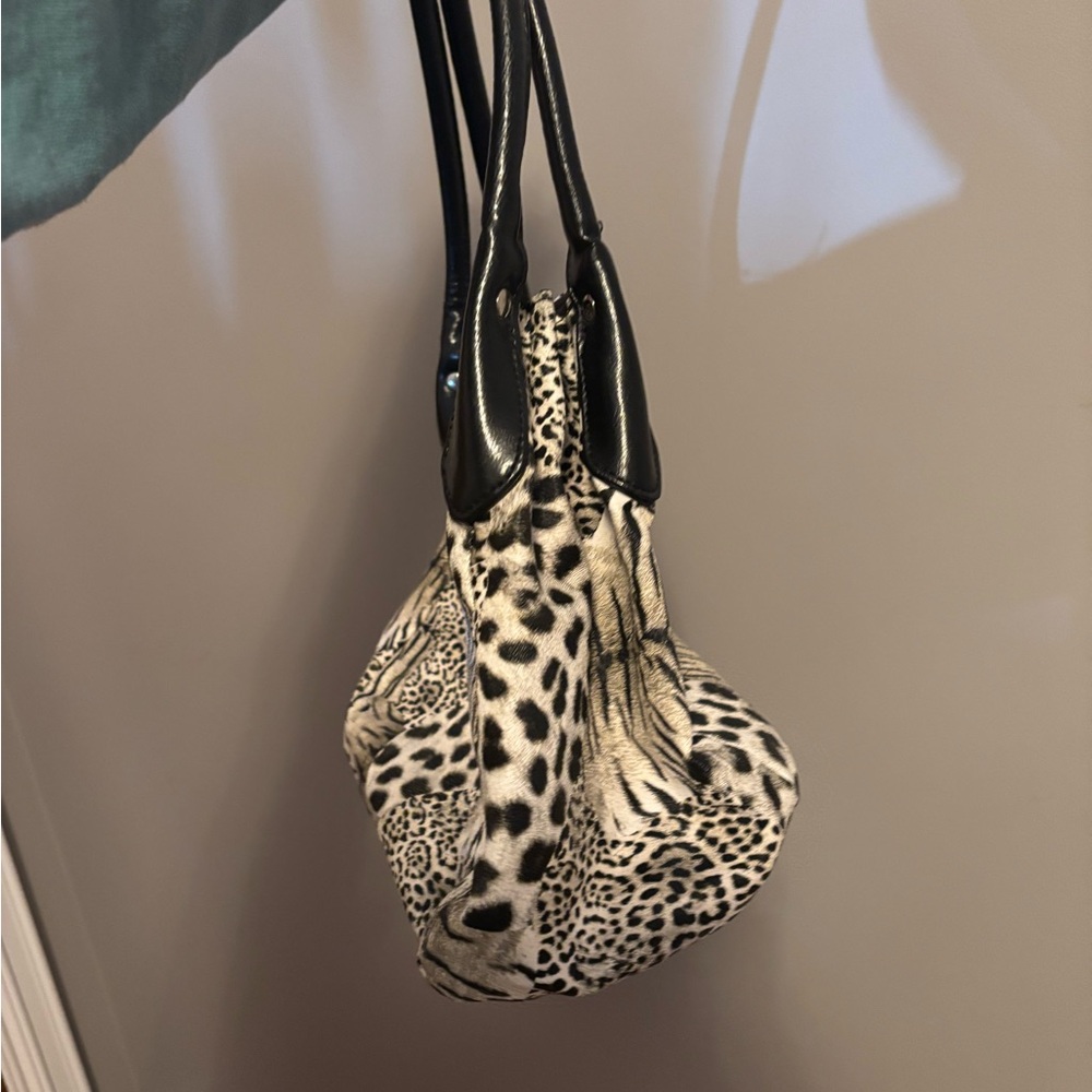 Black and white animal print shoulder bag.
